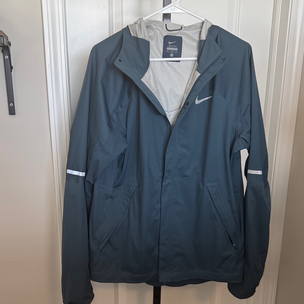 Nike Men's Dark Blue Hooded Rain Jacket with Reflective Accents